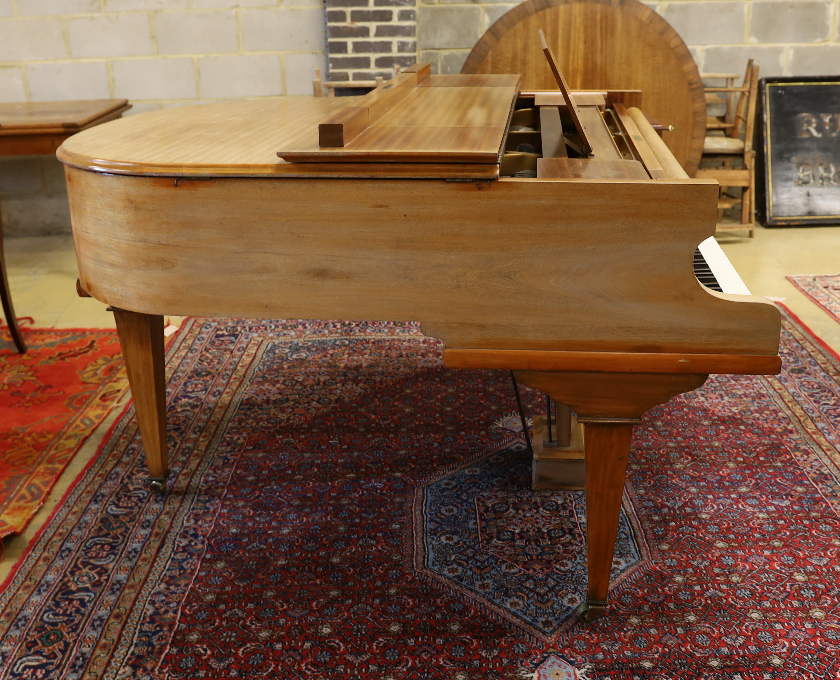 A mid 20th Cecilian & Co mahogany baby grand piano retailed by Harrods Ltd